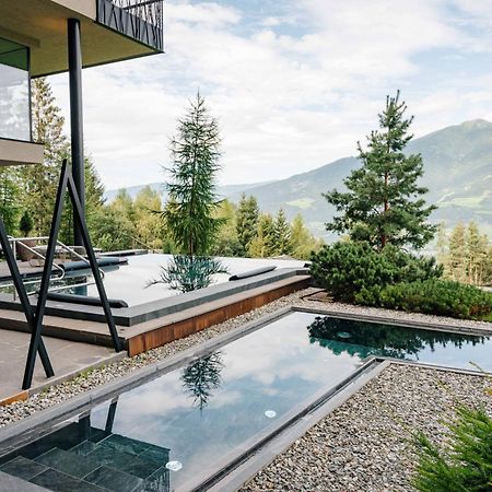 My Arbor - Dolomites Hotell Bressanone Eksteriør bilde A private swimming pool in the Alps