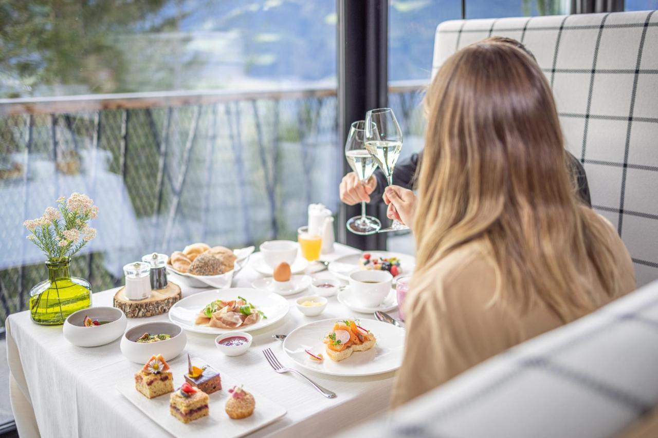 My Arbor - Dolomites Hotell Bressanone Eksteriør bilde A woman enjoying a meal at a restaurant
